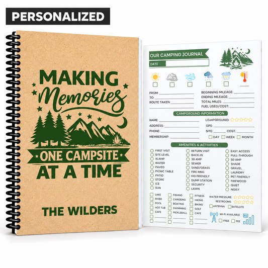 A personalized spiral-bound camping journal set shown on a white background. The closed journal has a kraft-paper style cover with dark green text reading 'Making Memories One Campsite at a Time' and 'The Wilders,' plus a pine tree and mountain illustration.