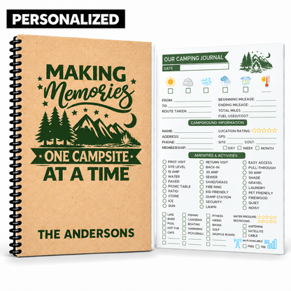 Personalized camping journal with black coil binding, a tan personalized cover and green woodland design reading “Making Memories One Campsite at a Time” and “The Andersons.” A campground log page appears beside the book.